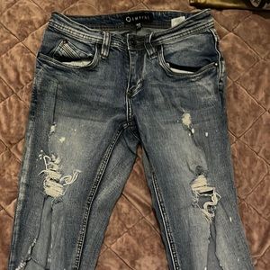 Very distressed skate skinny jeans